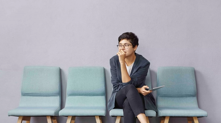 woman waiting for court after delays.