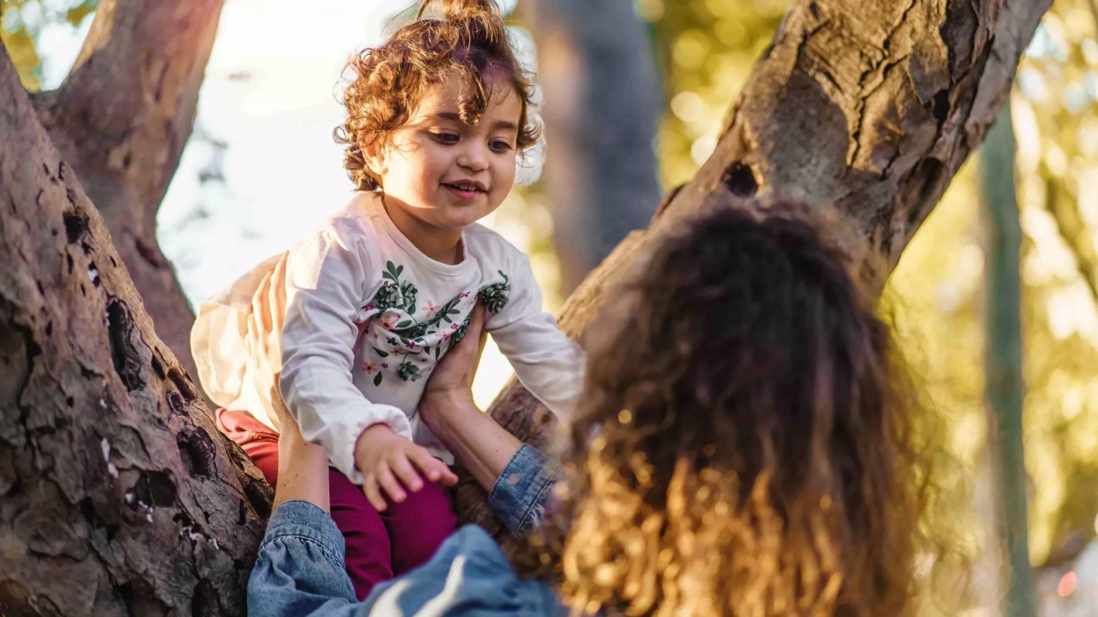 Parent holding a child’s hand to represent relative and step-parent adoption