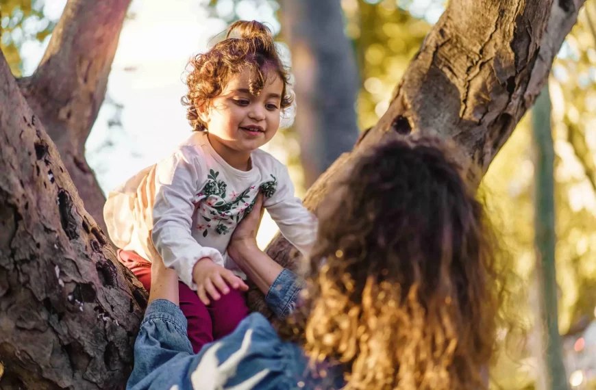 Parent holding a child’s hand to represent relative and step-parent adoption